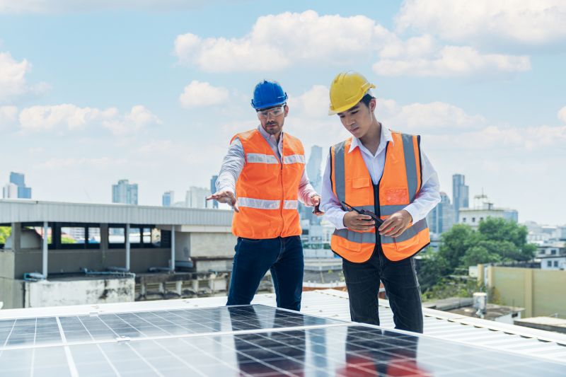 Technicians Servicing Solar Panels